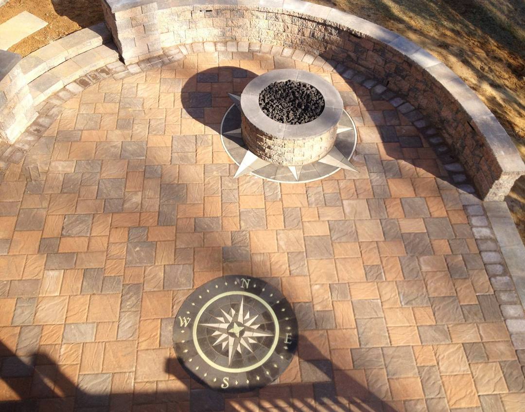 Bristol stone paver patio with a gas fire bowl and compass inlay