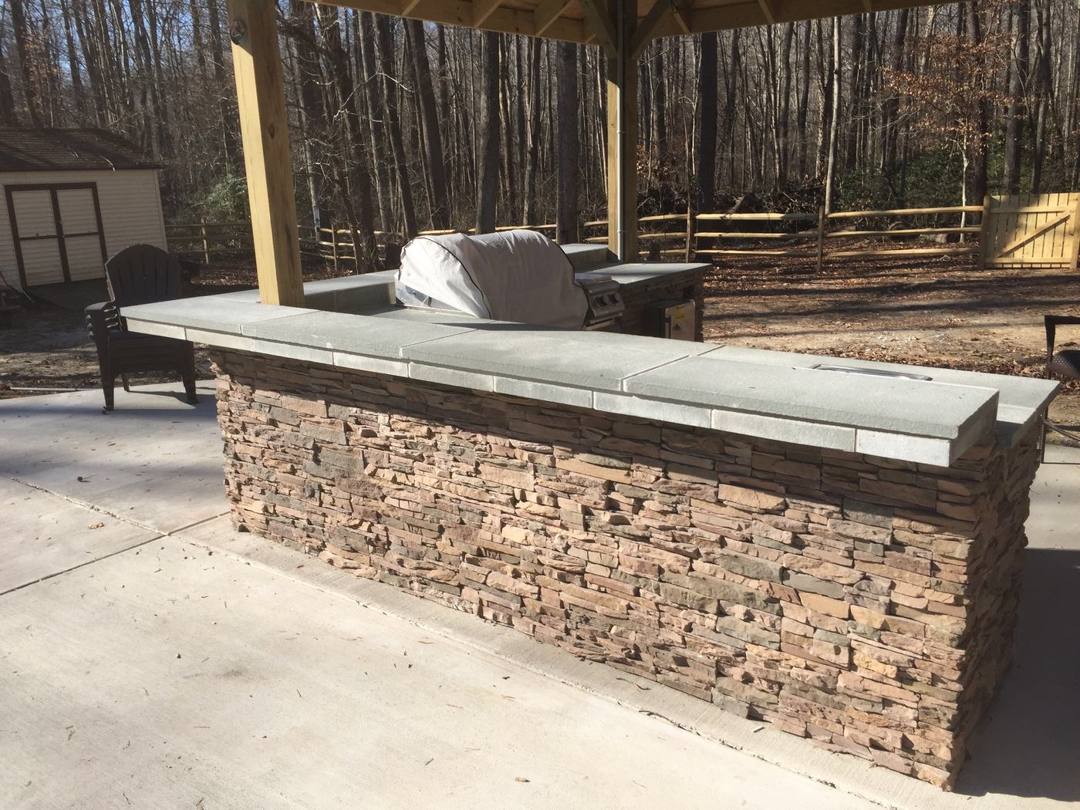 Stacked-stone bar with a bluestone countertop