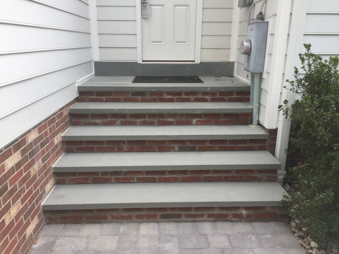 Brick steps with bluestone treads to a side door